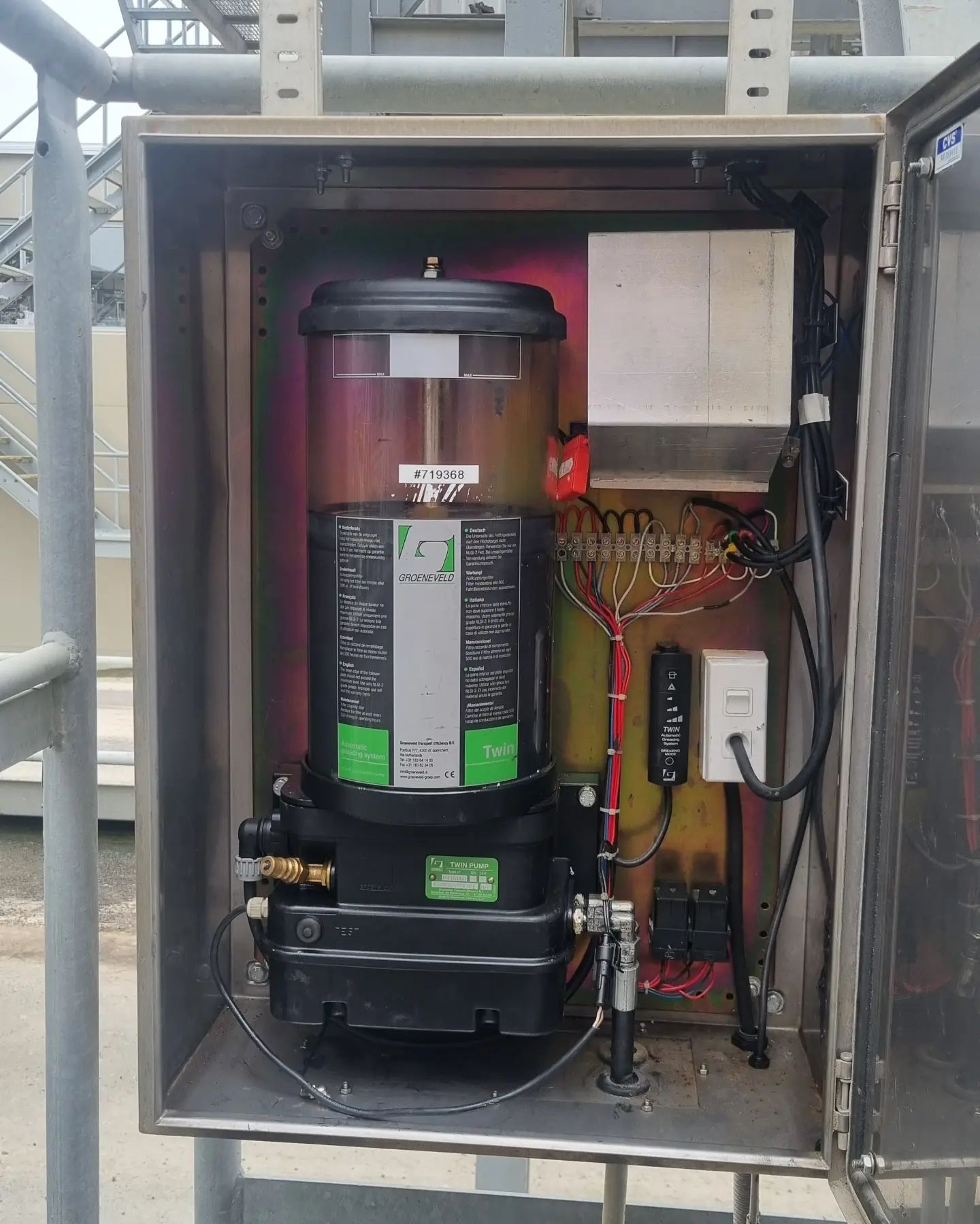 Groeneveld Twin grease pump installed in a protected fixed plant cabinet